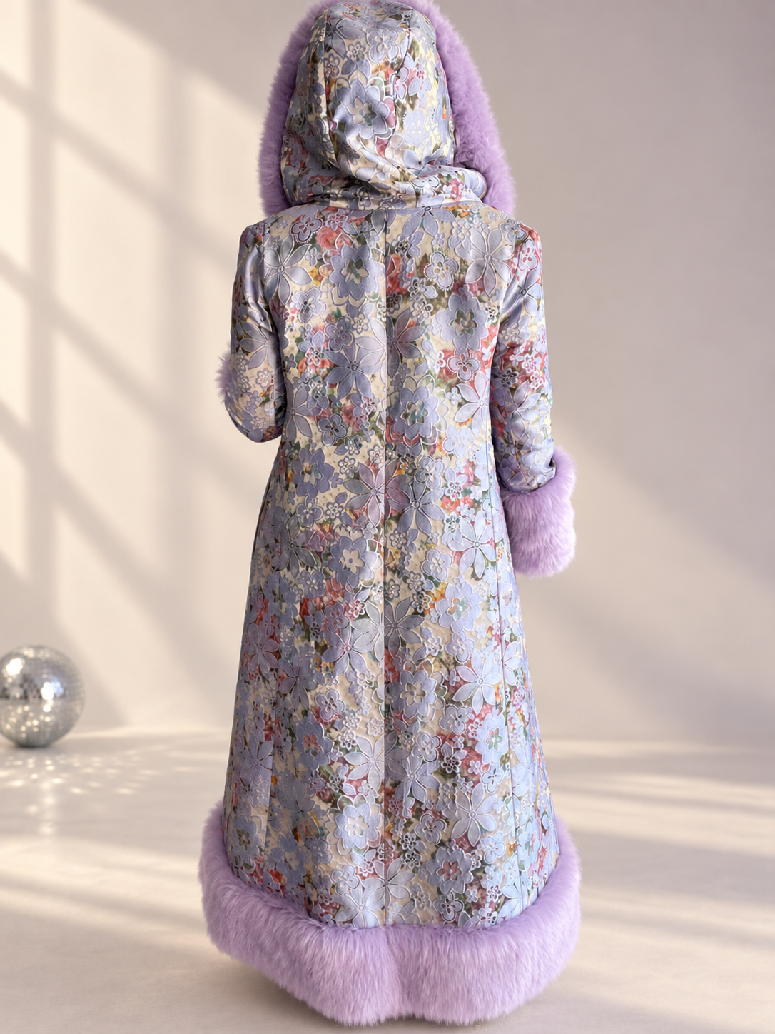 Back view of Lilac Princess full-length floral brocade coat with lilac faux fur hood, cuffs, and hem